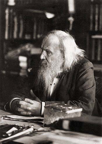 Dmitri Mendeleyev at a table, talking